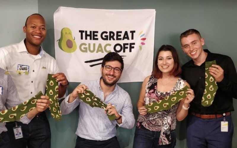 The winning team with their avocado prizes after a corporate team building event.